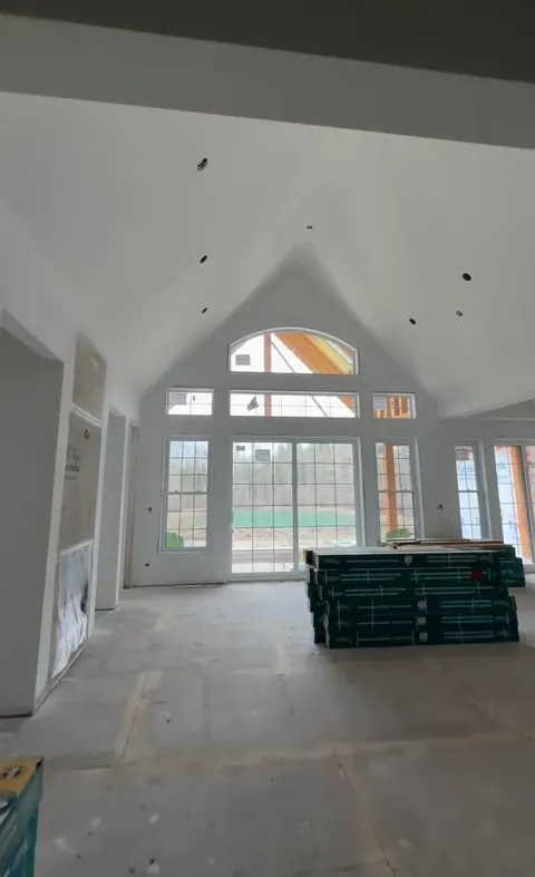 A walk through a vaulted house from framing and insulation to smooth, finished walls and ceilings.